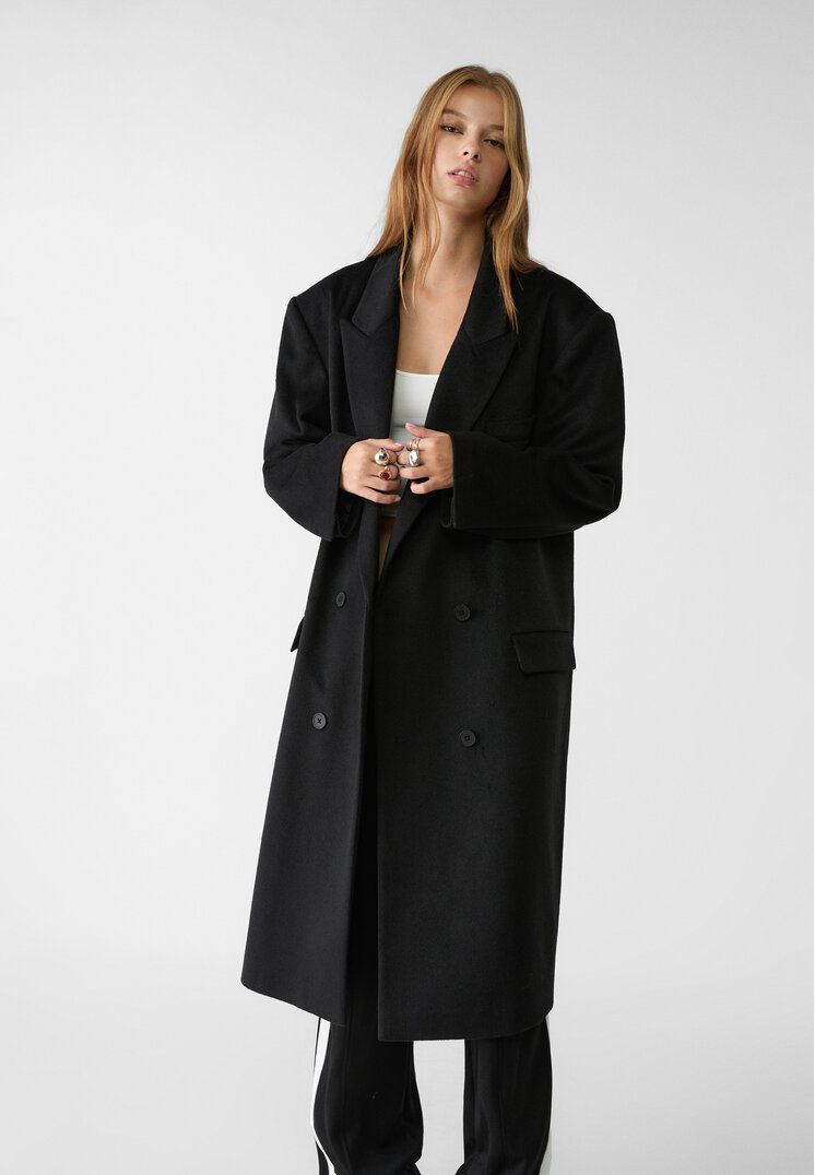abrigo largo oversize bolsillos