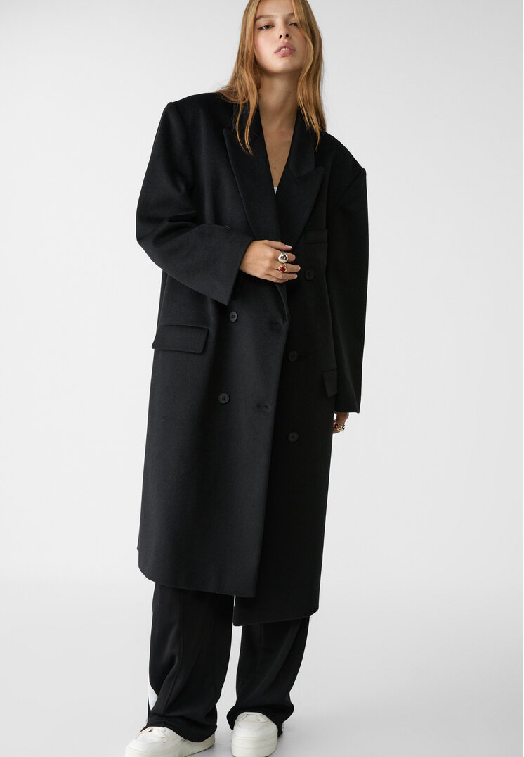 abrigo largo oversize bolsillos