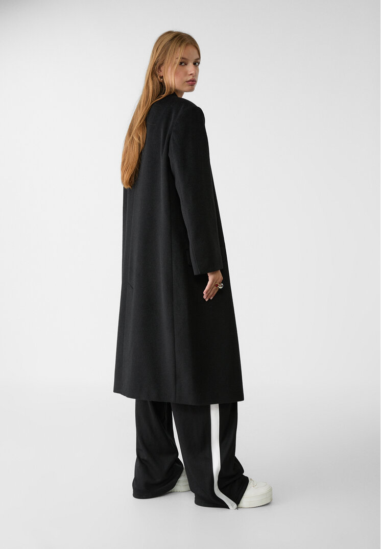 abrigo largo oversize bolsillos