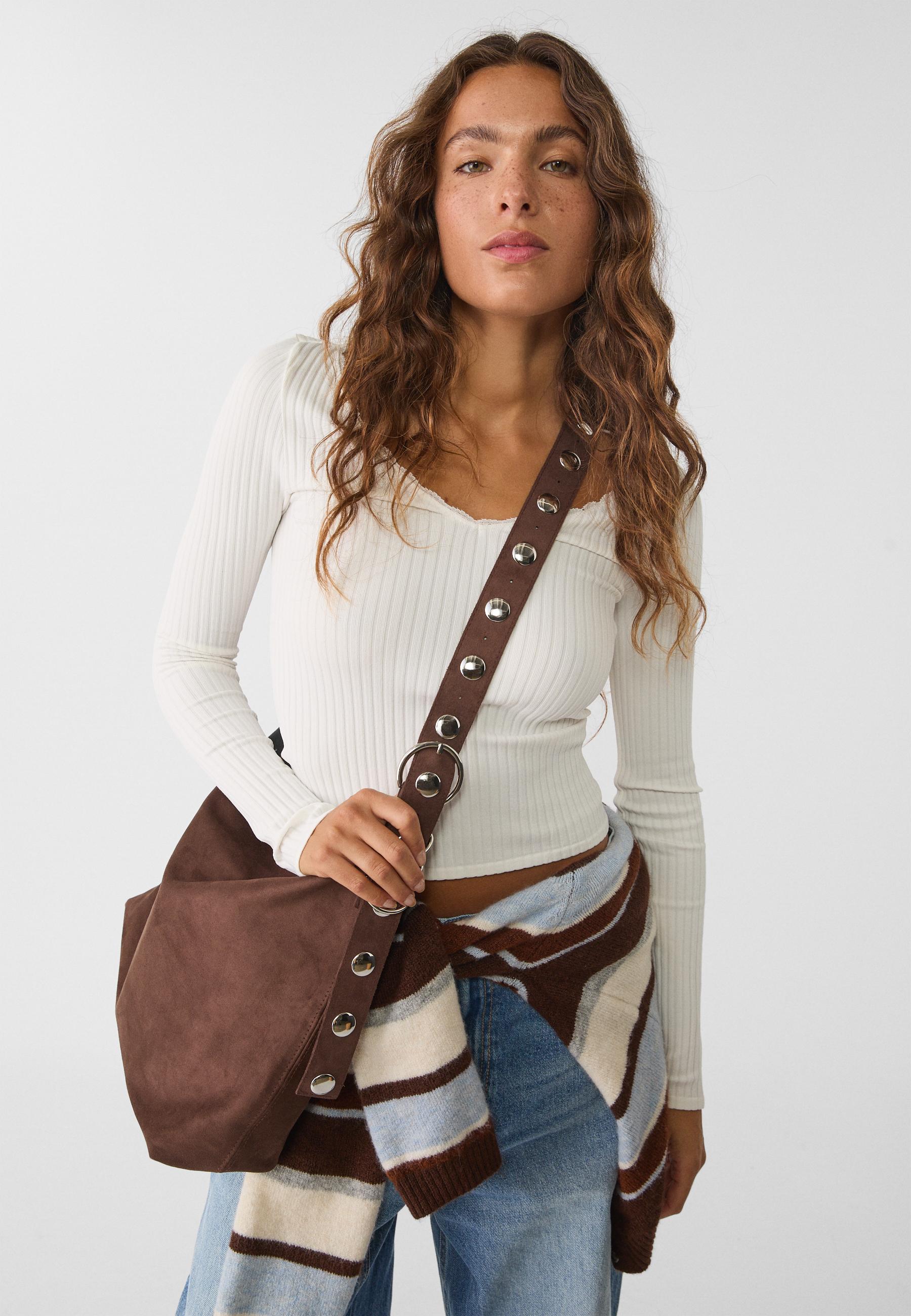 Faux suede bucket bag with strap detail — Brown