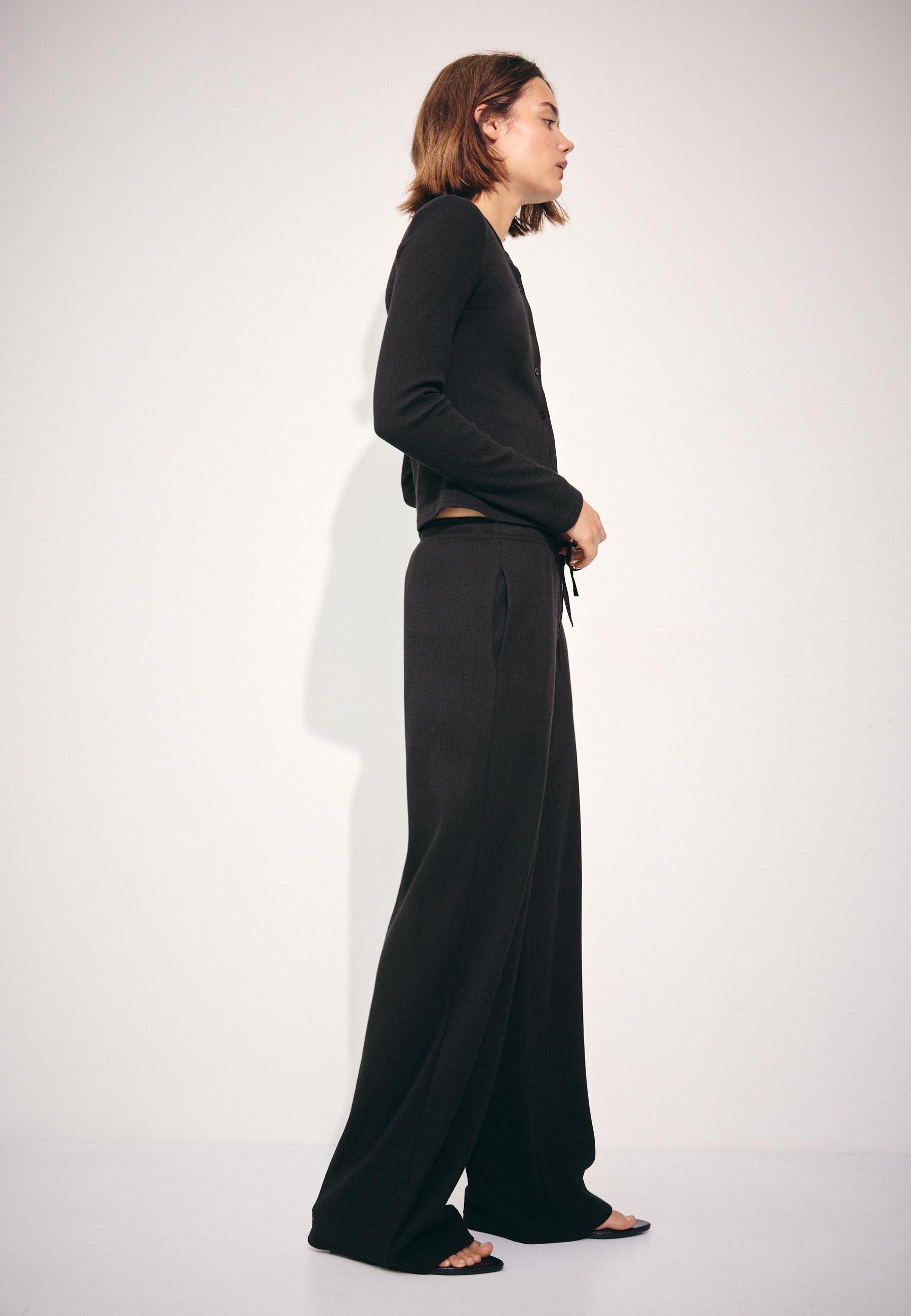 Soft-touch ribbed trousers — Black