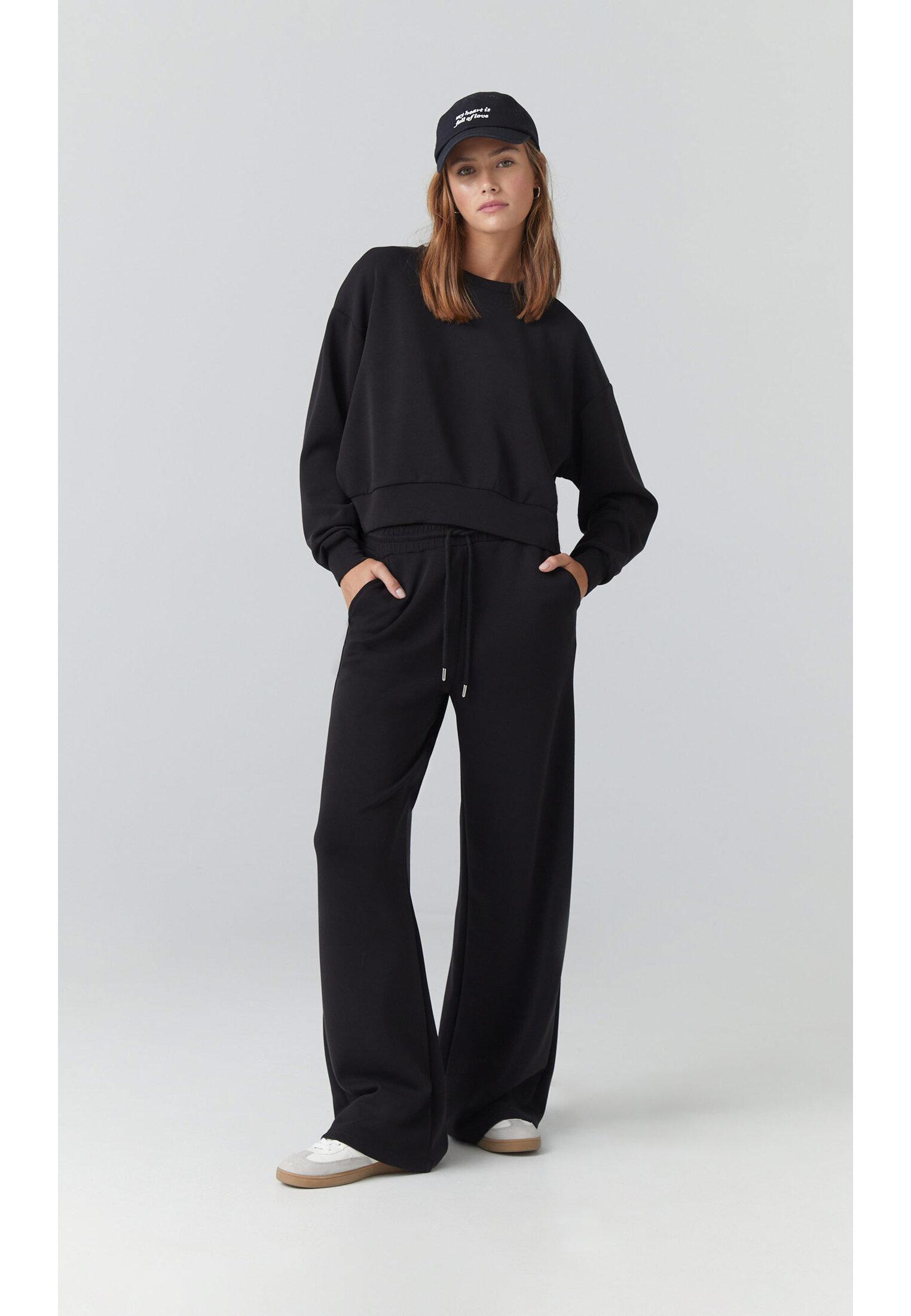 Soft-touch palazzo joggers — Black