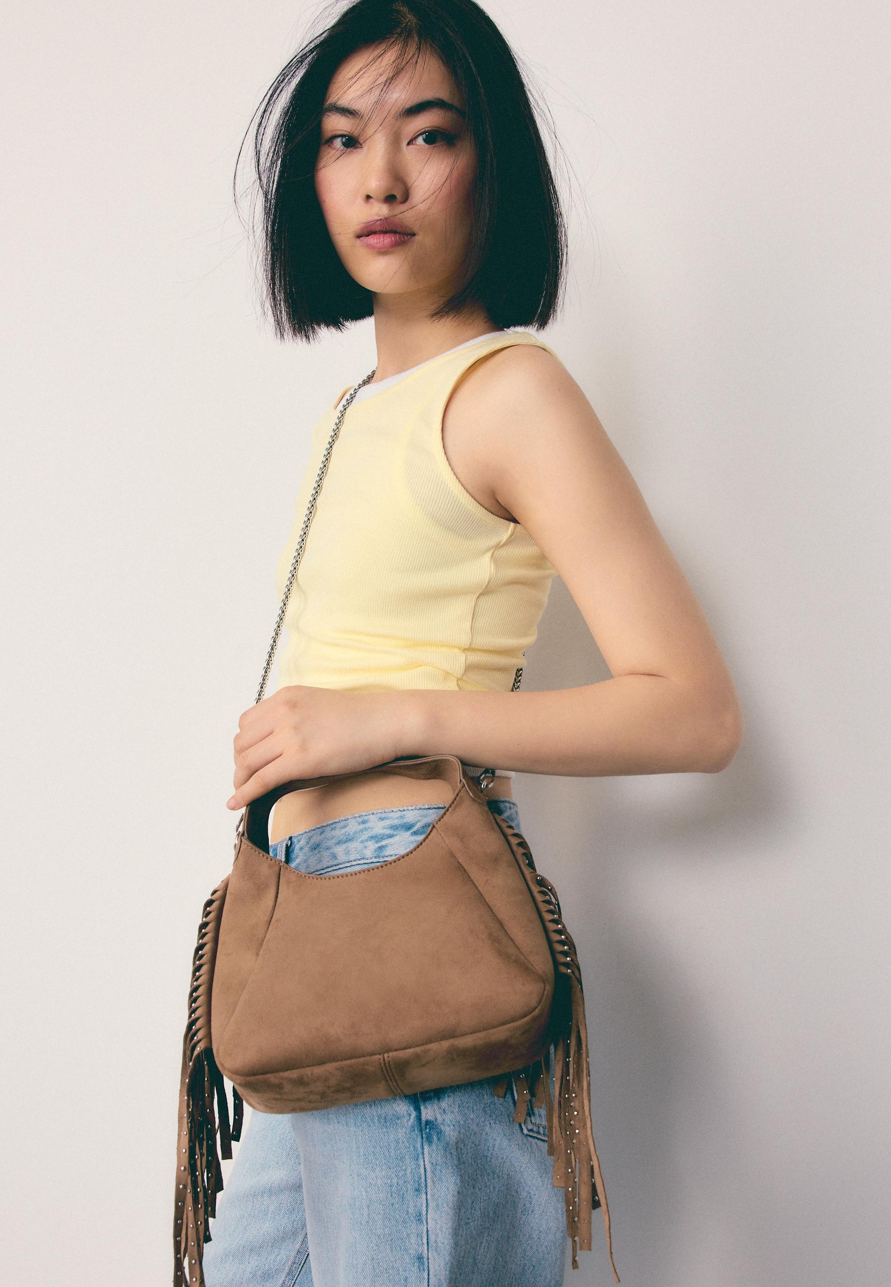 Yanları püsküllü omuz çantası