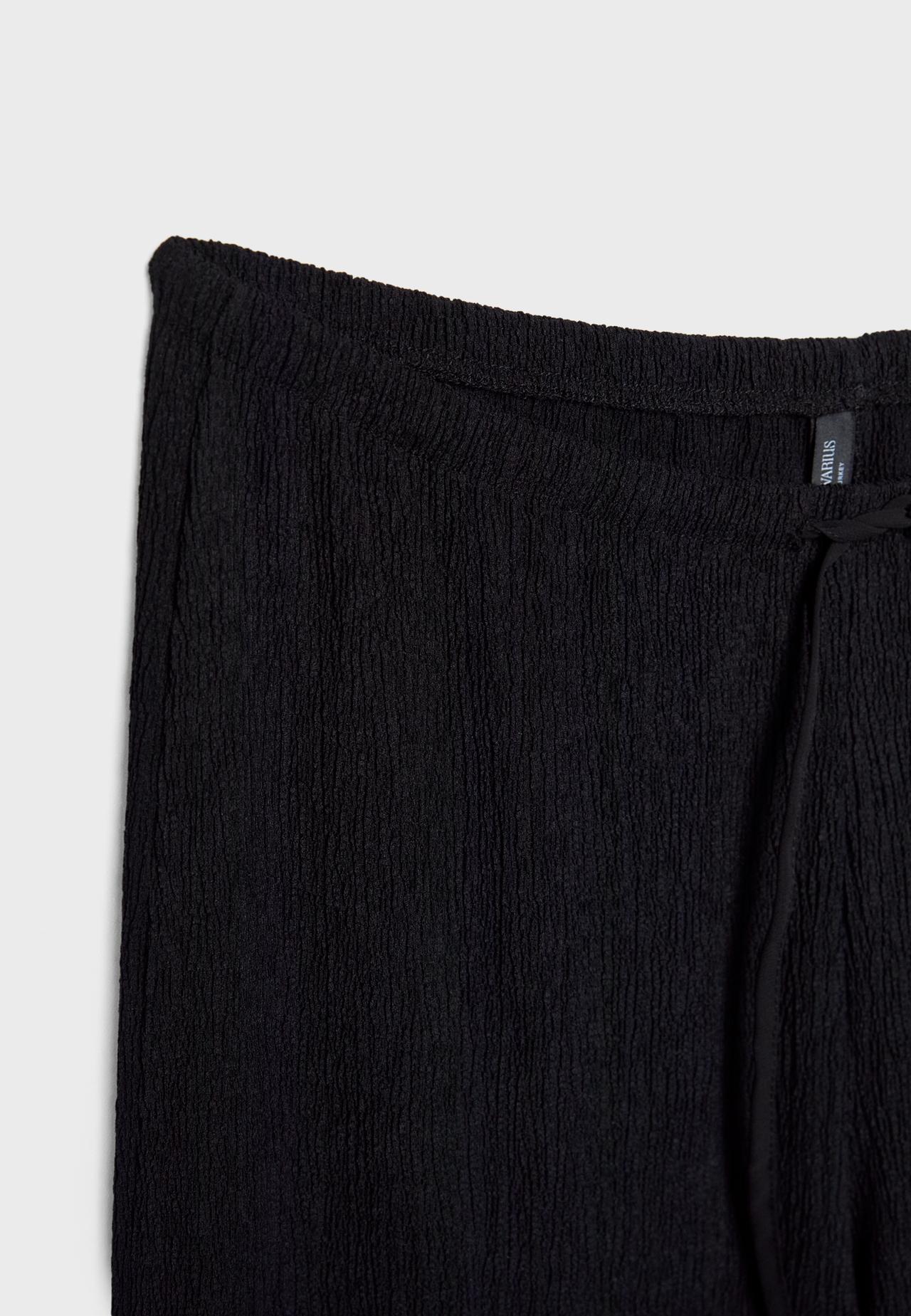 Creased-effect straight trousers — Black