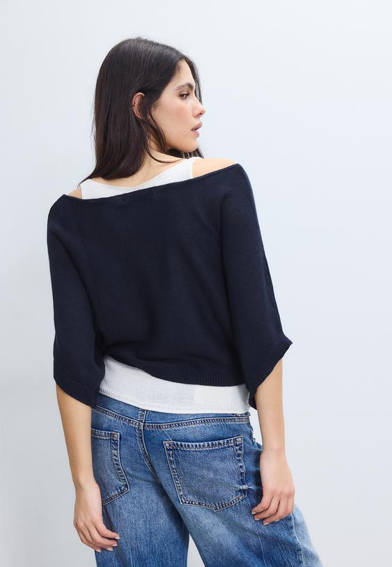 maglia a barchetta con sovrapposizione