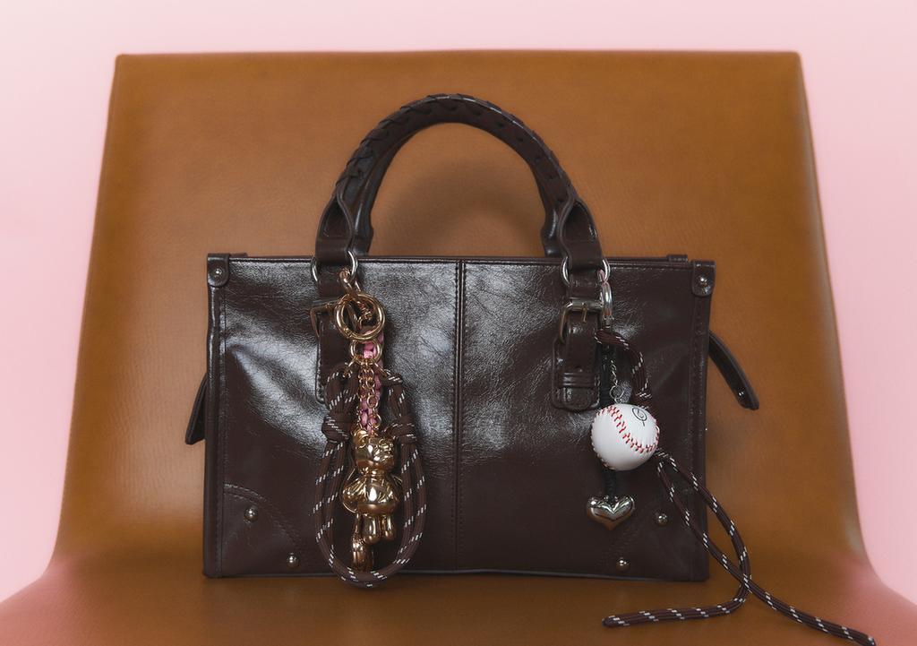 Medium crossbody bag with a braided strap.