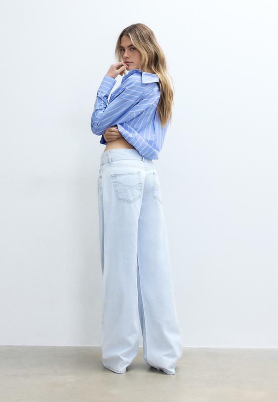 jeans de cintura baixa com botao duplo