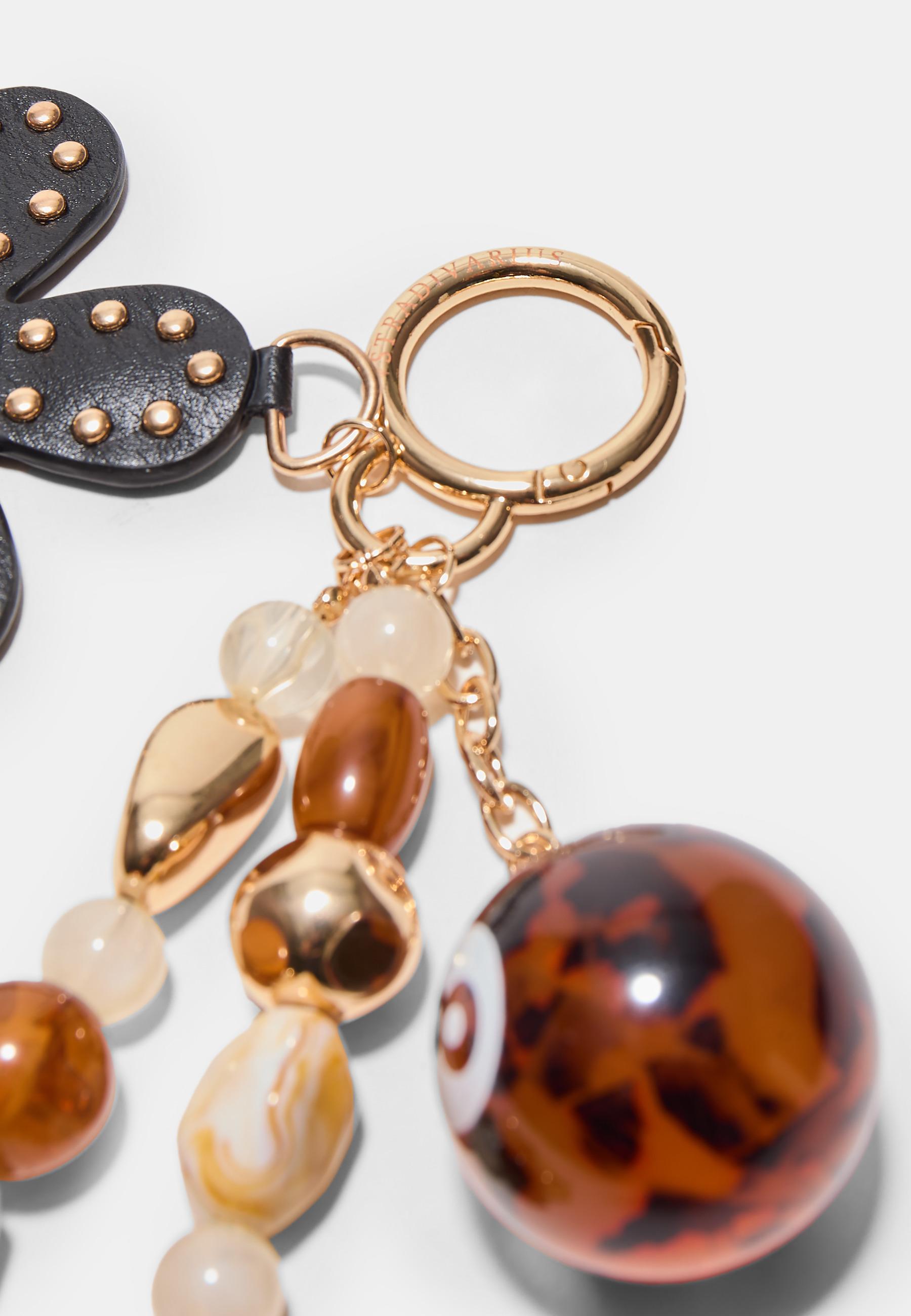Flower and 8 ball charm — Brown