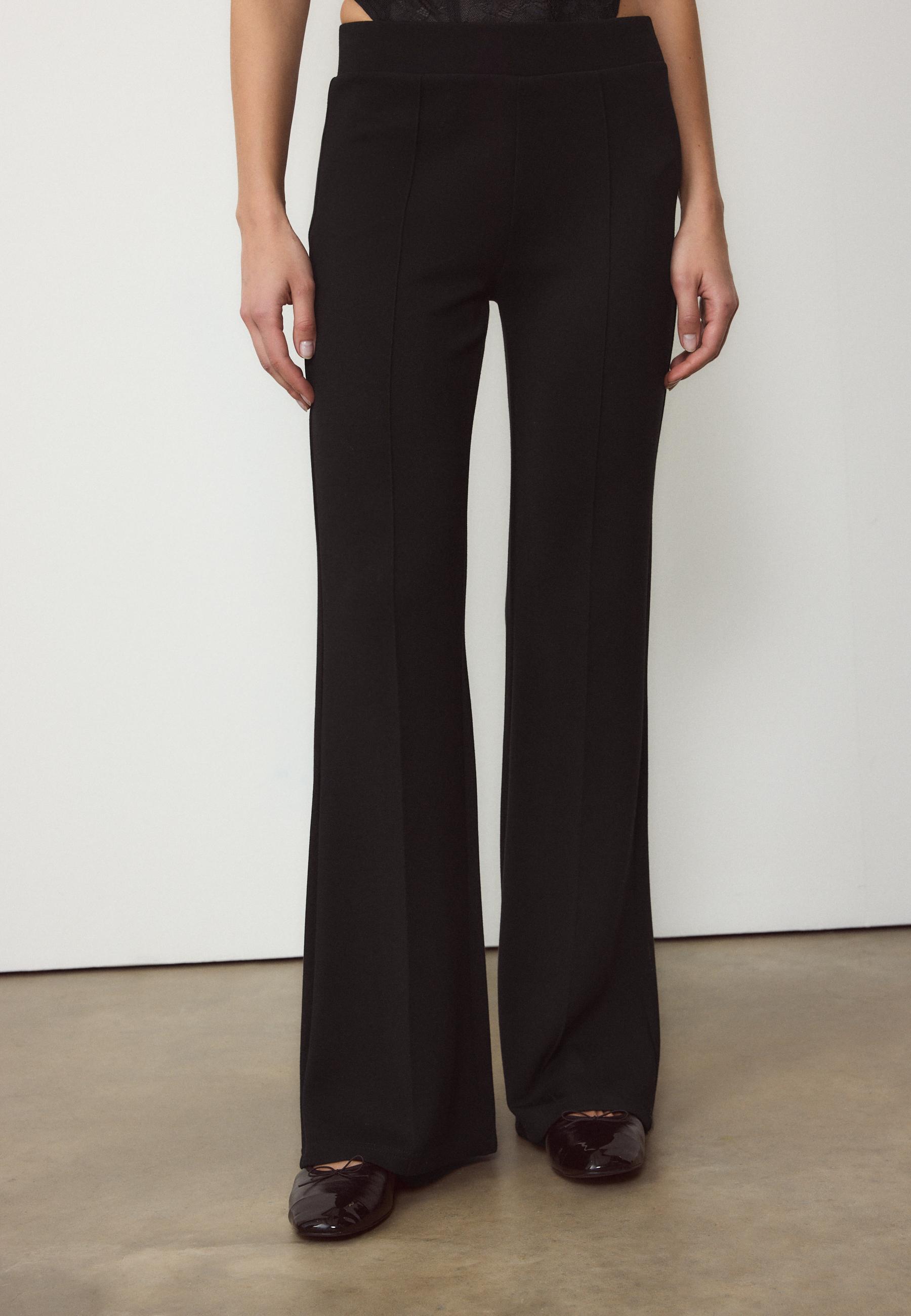 Soft-touch bell bottom trousers with front seam detail — Black