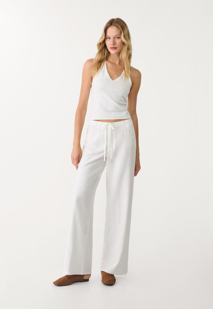 pantalon fluido bolsillos