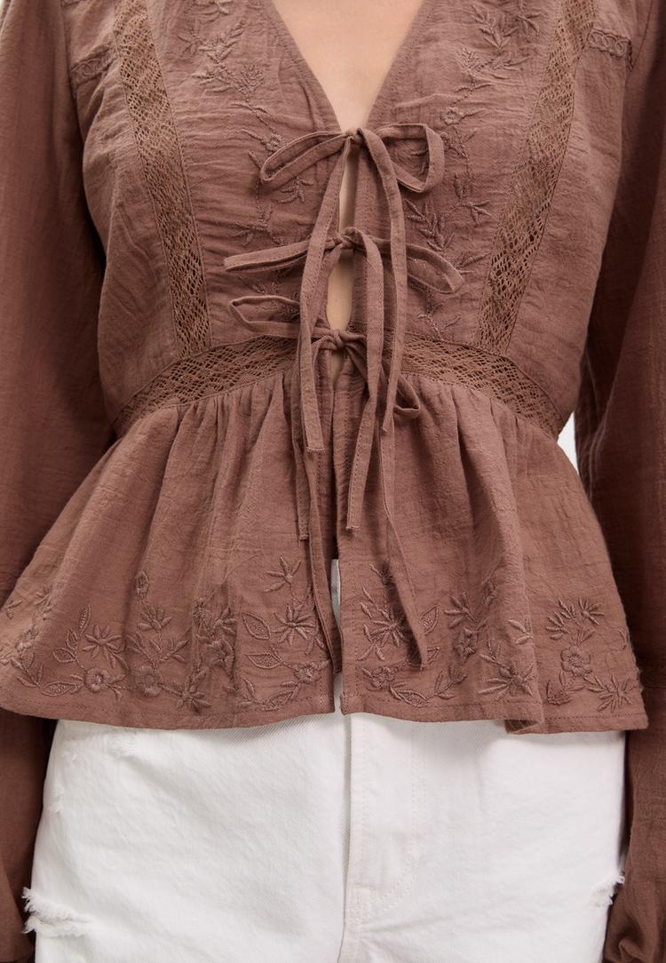 loose fitting embroidered knot blouse