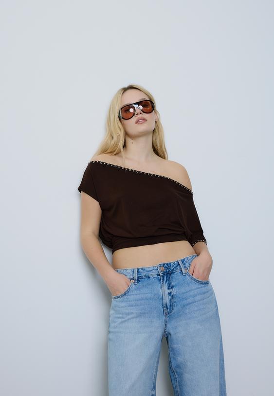 maglietta asimmetrica borchie