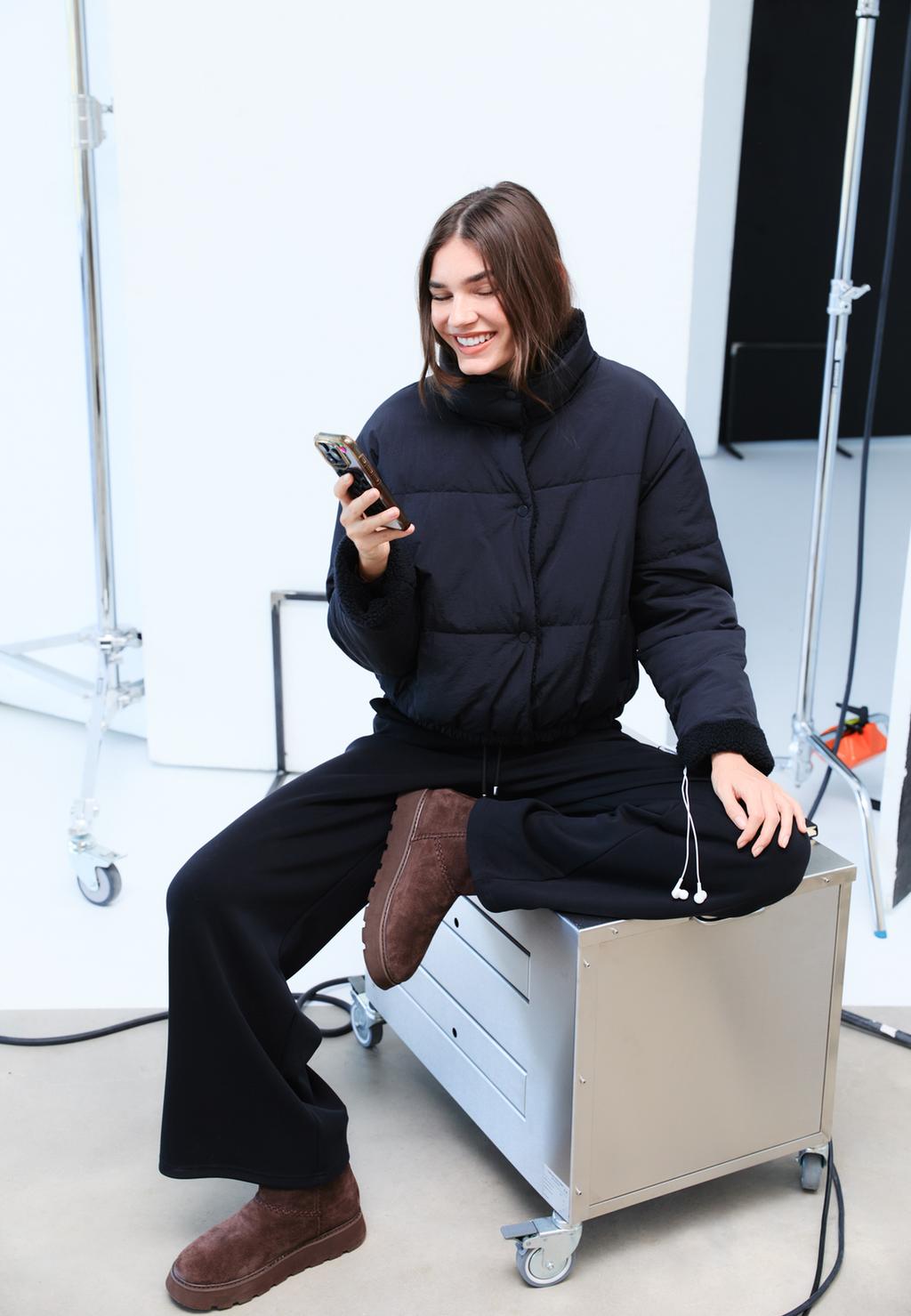 Omkeerbaar gewatteerd jack van synthetisch teddy