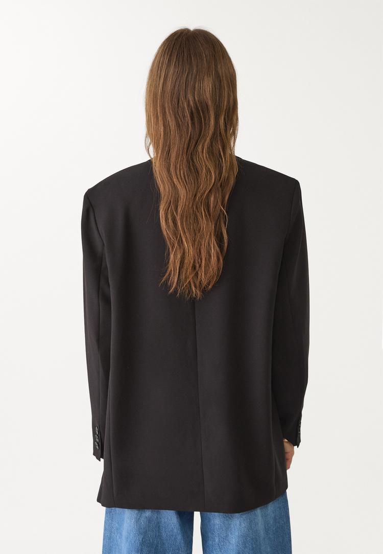 americana oversize bolsillos