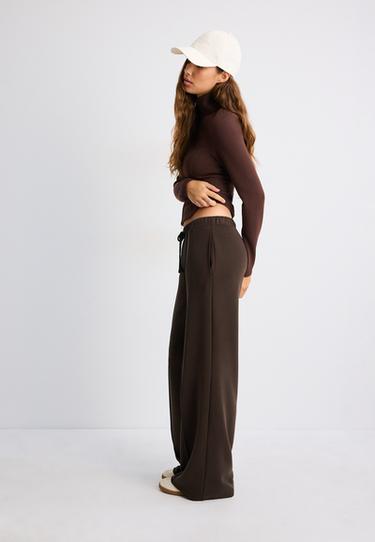 Soft-touch wide-leg jogger trousers with pin tuck — Brown 1