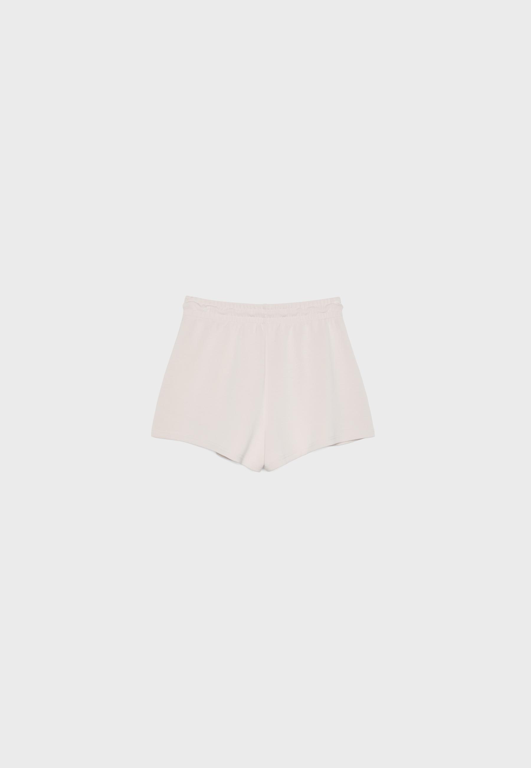 Soft-touch shorts with darts — Stone