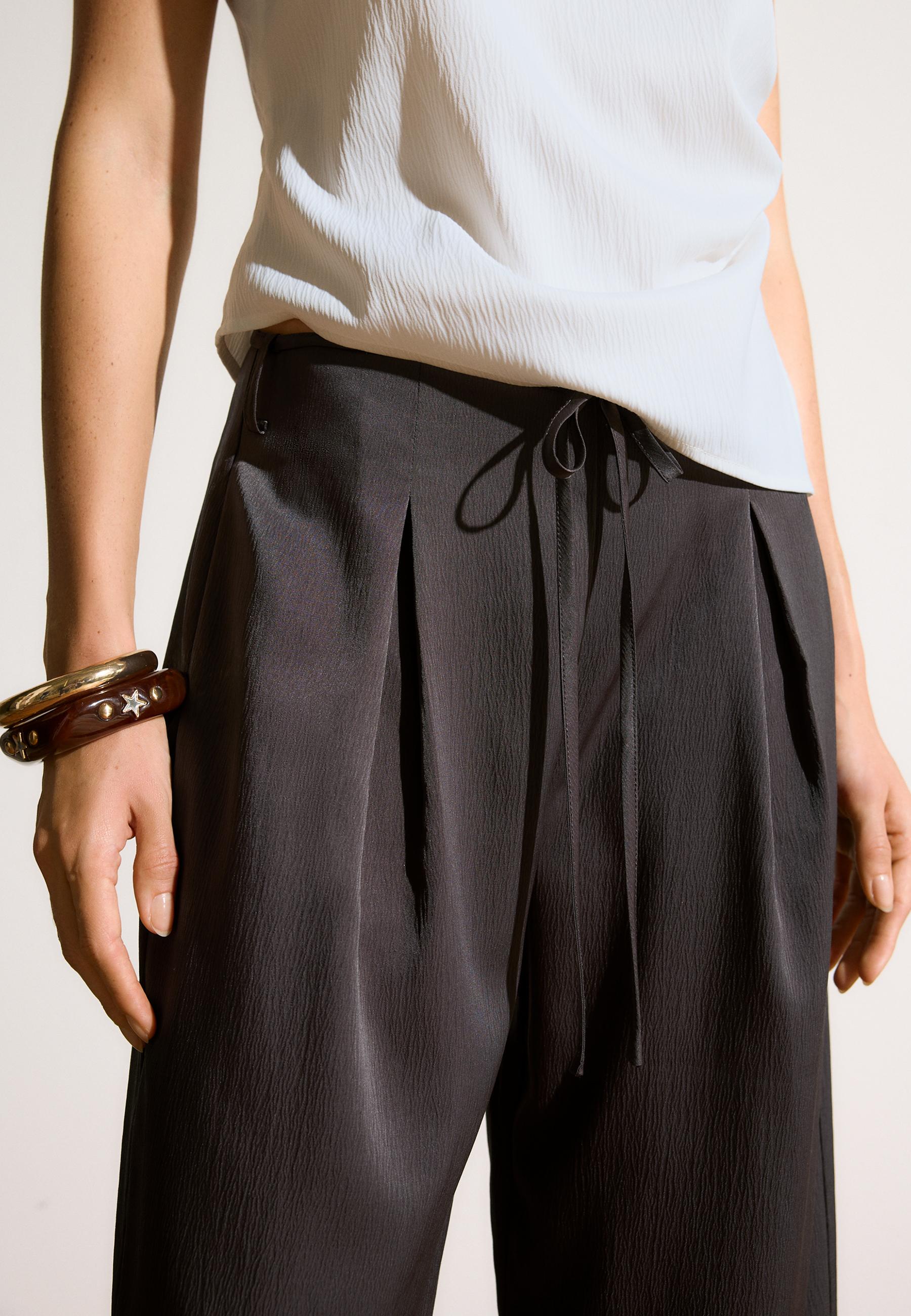 Flowing creased-effect trousers with tie — Brown