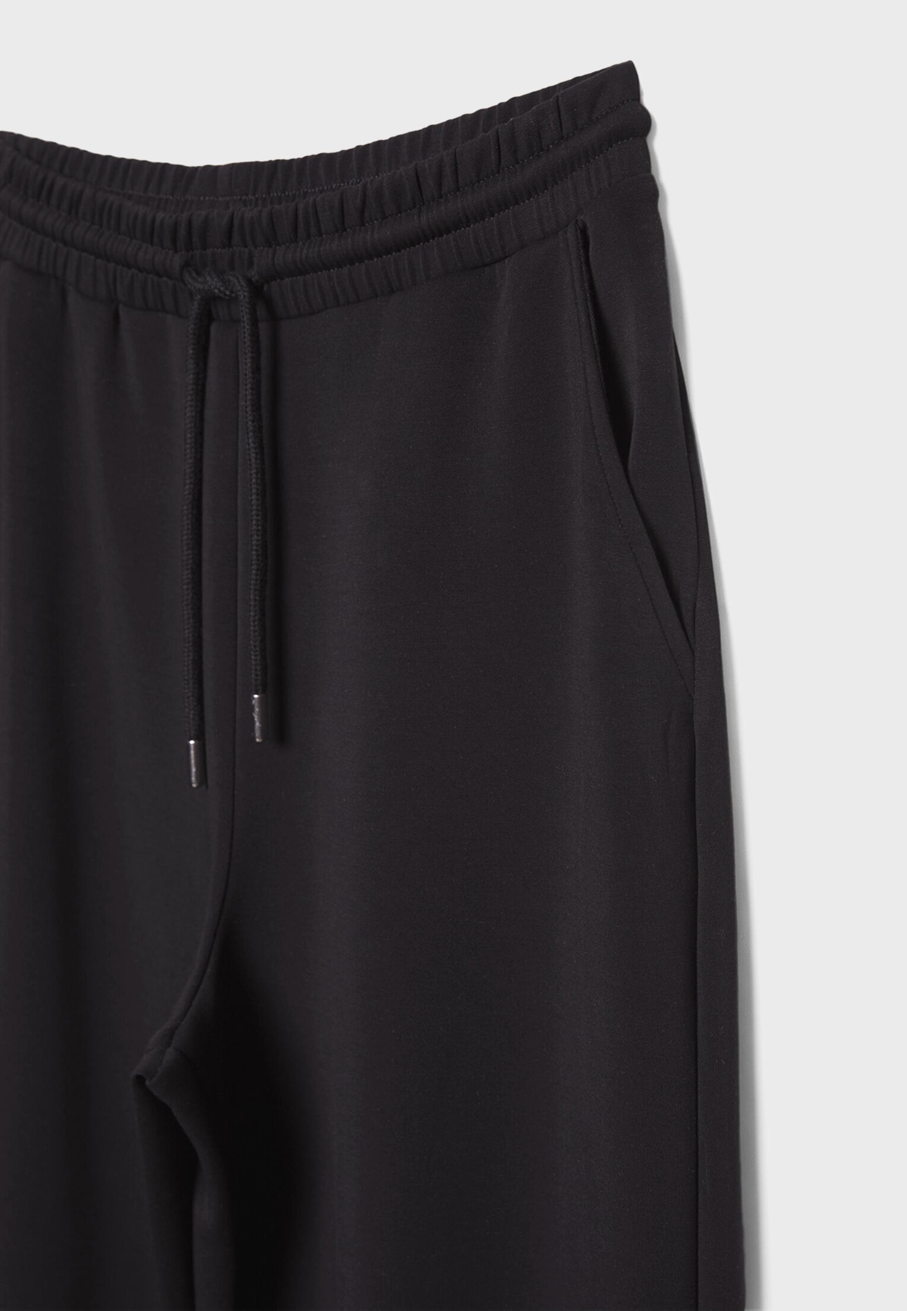 Soft-touch palazzo joggers — Black