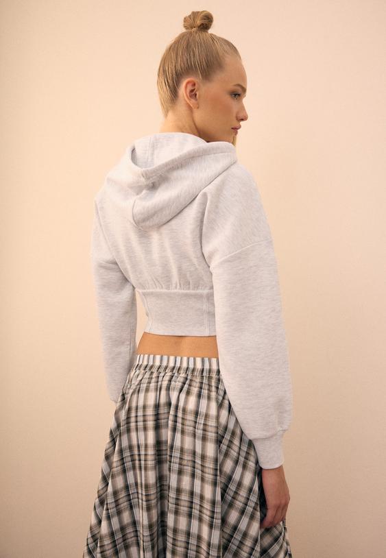 sweater met korsetdetails