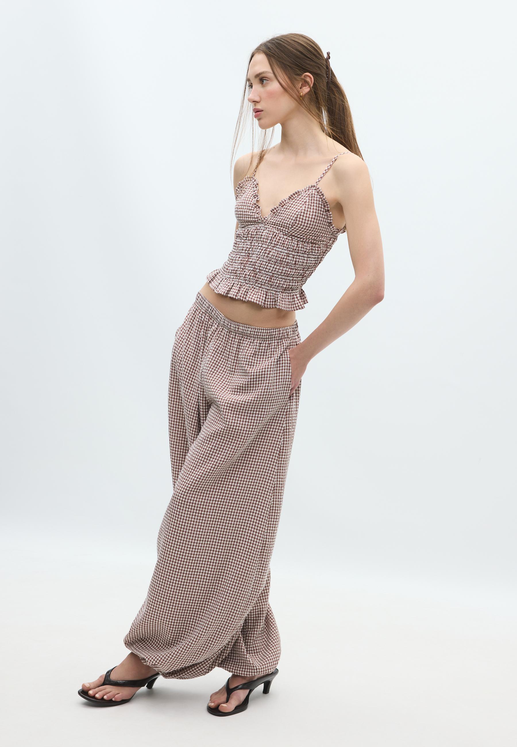 Checked print voluminous trousers — Terracotta