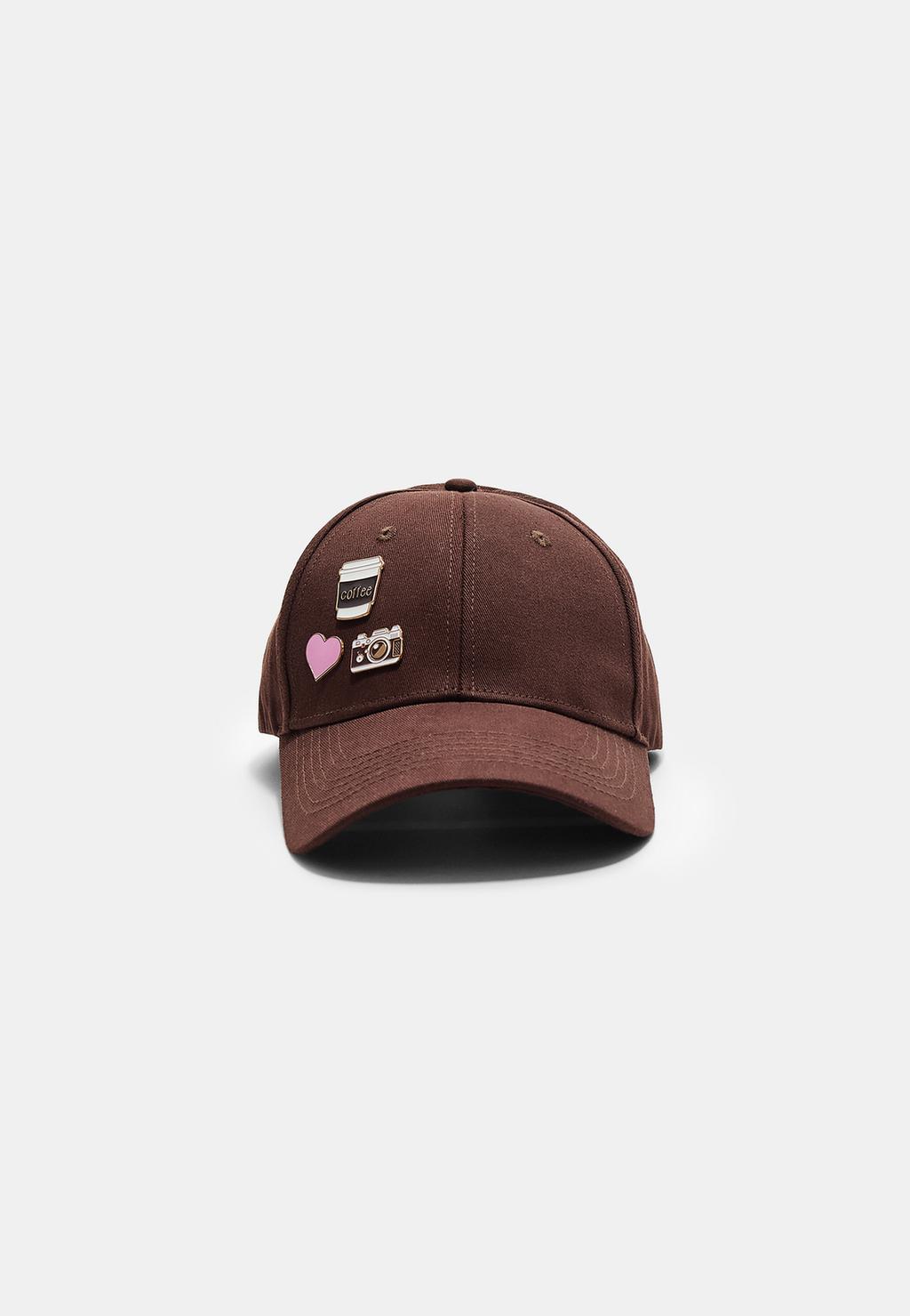 Cap with multiple badges