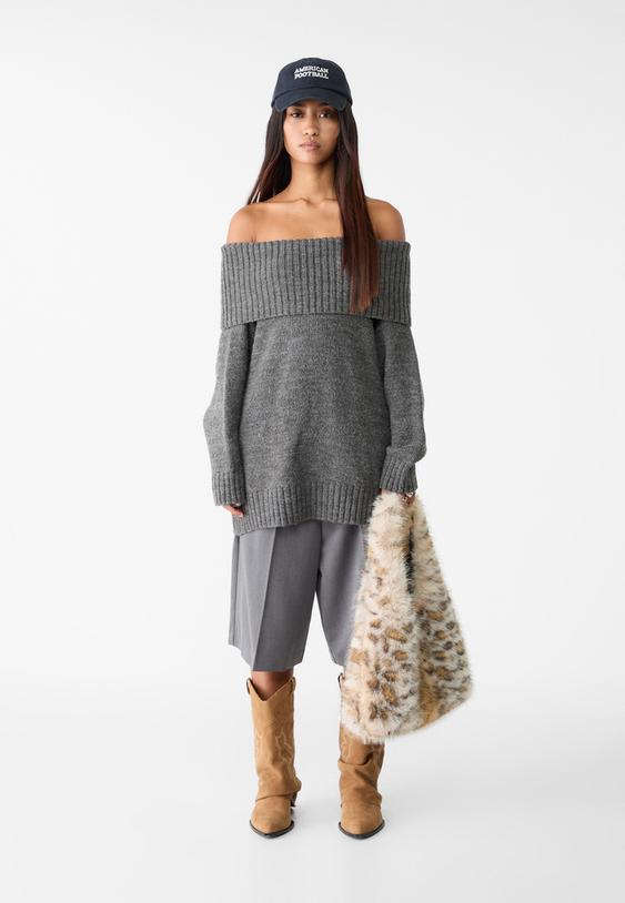 maglia in maglia con spalle scoperte