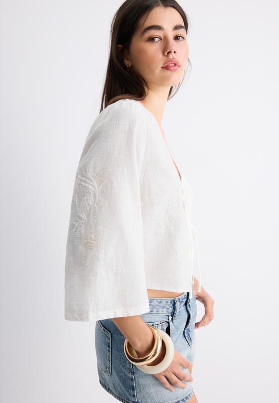 camicia nodi ricami perle