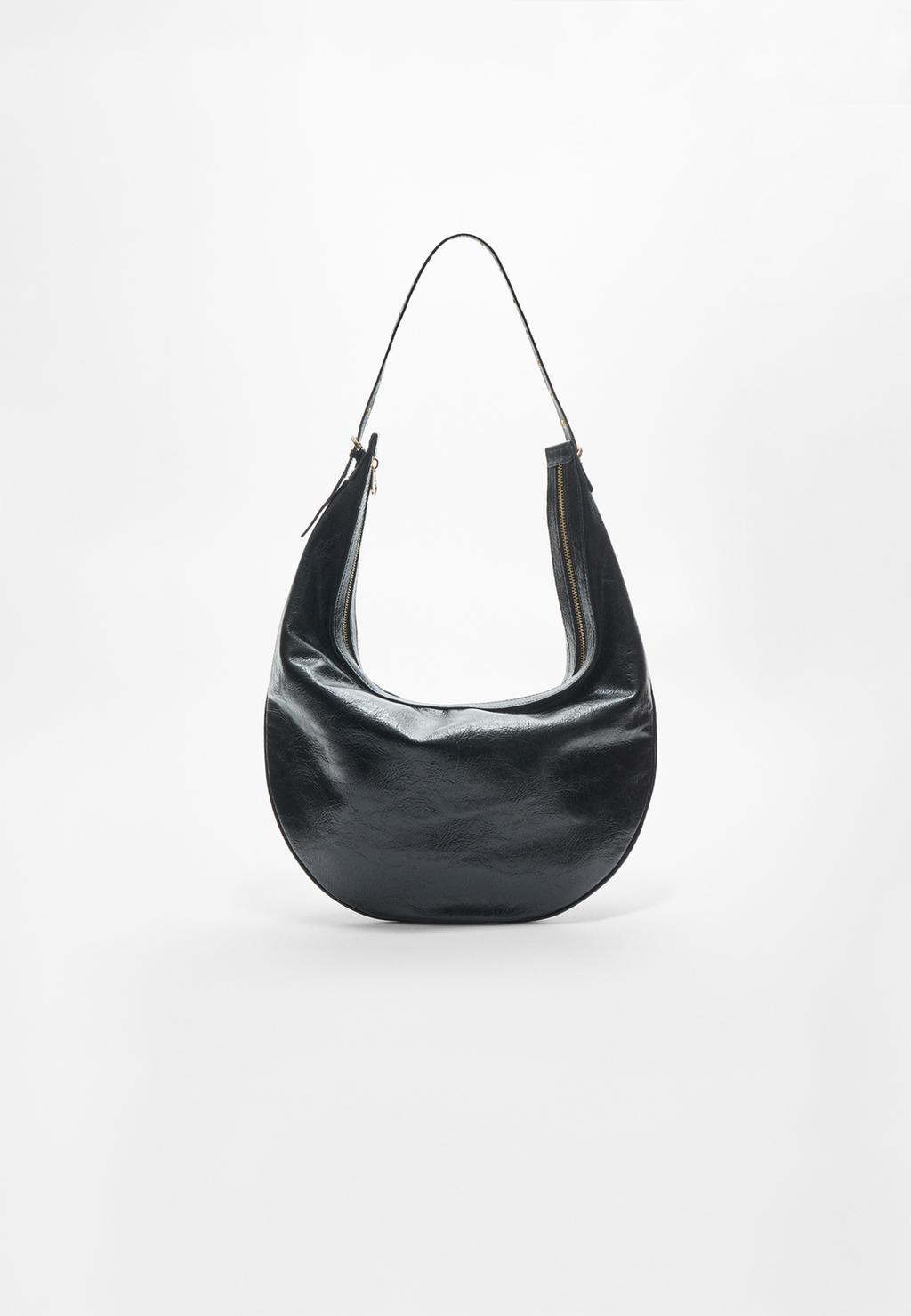 Half moon bag with detailed strap