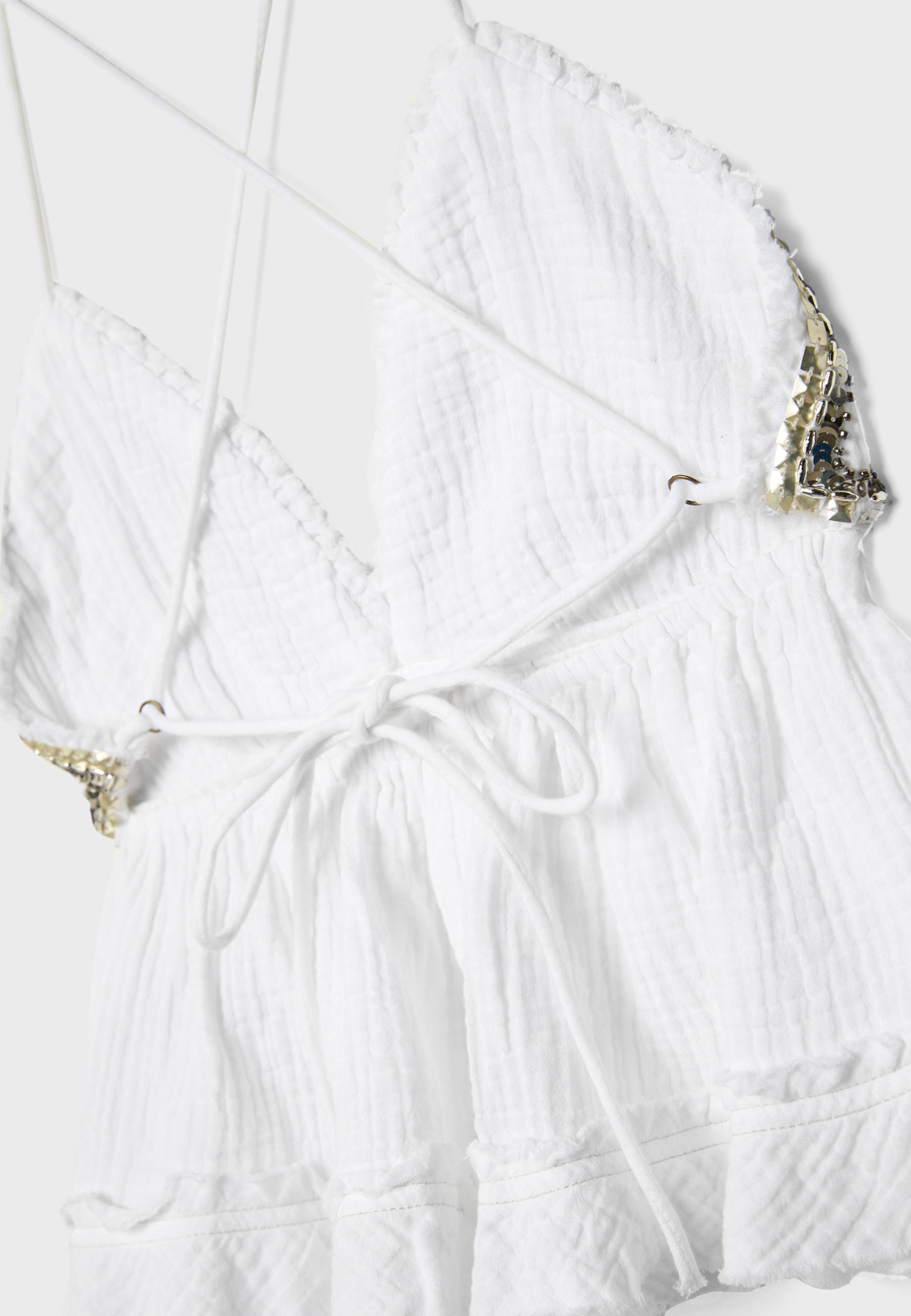 Ruffled and beaded top — Ecru