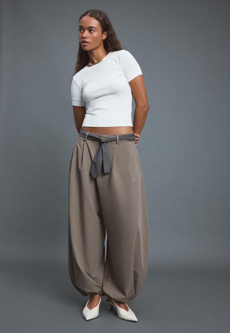 Voluminous sarouel trousers with tie detail — Brown