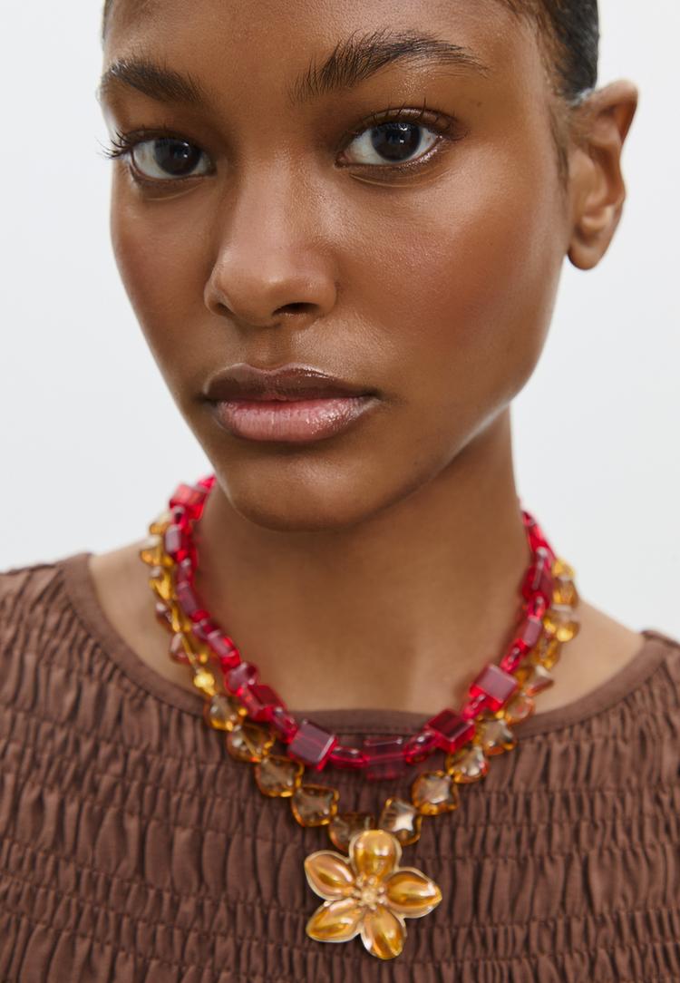 set 2 collares abalorios y flor