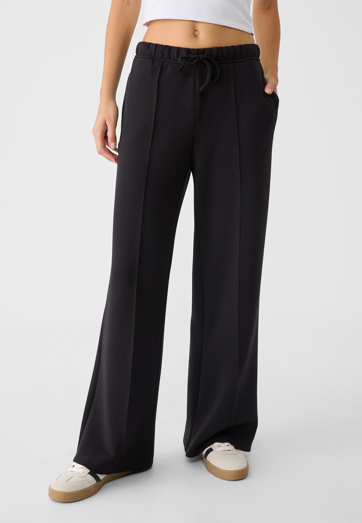 Soft-touch wide-leg pin-tuck joggers — Black