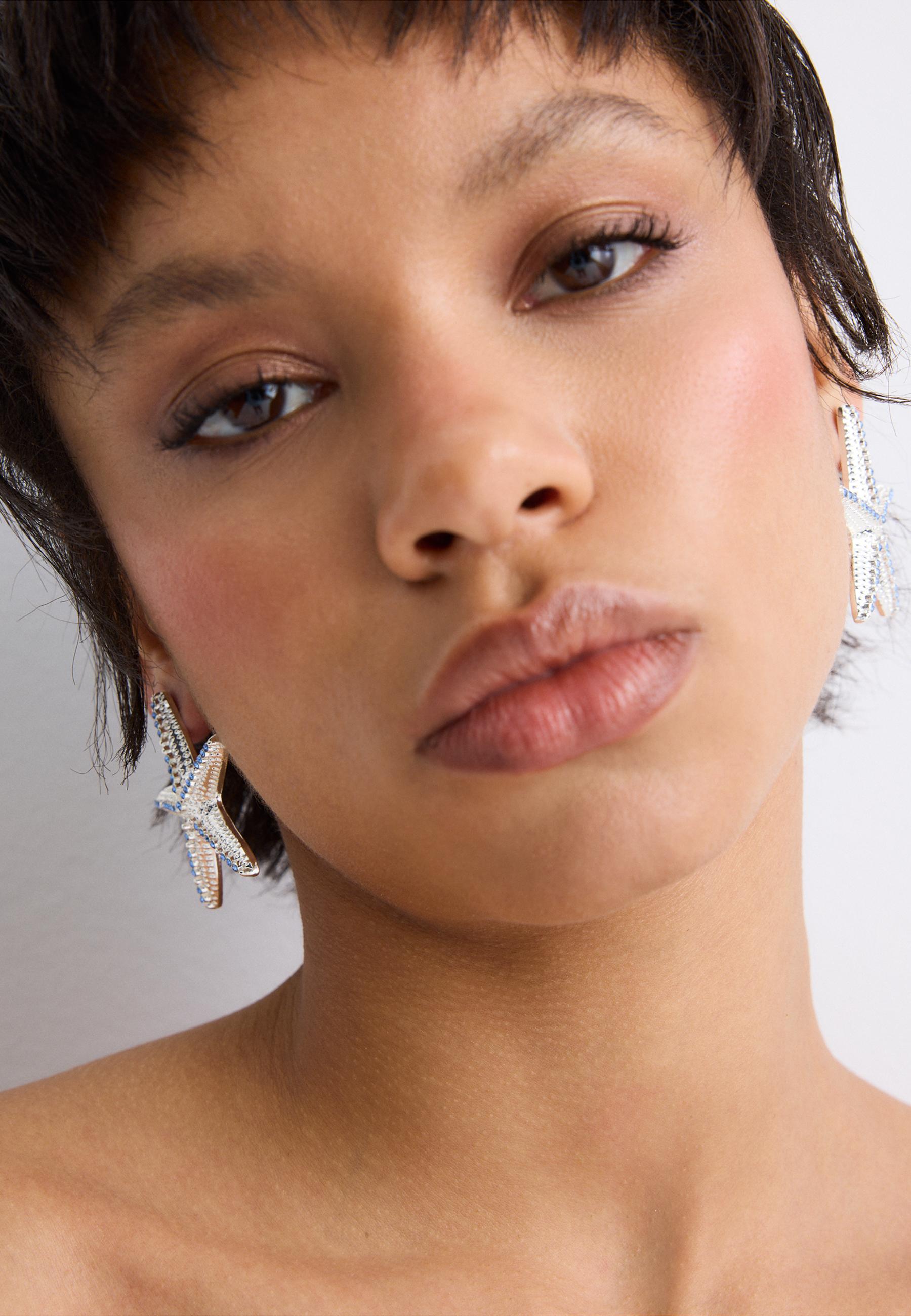 Starfish stud earrings — Grey