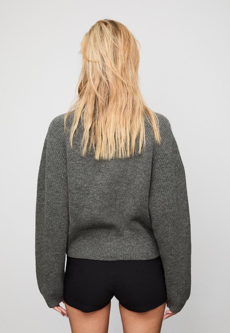 gebreid vest met knopen