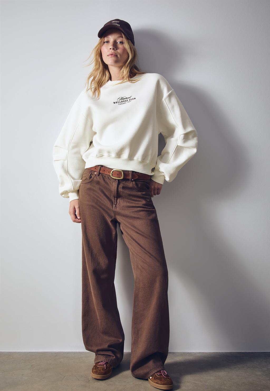 Embroidered sweatshirt with darts on sleeves