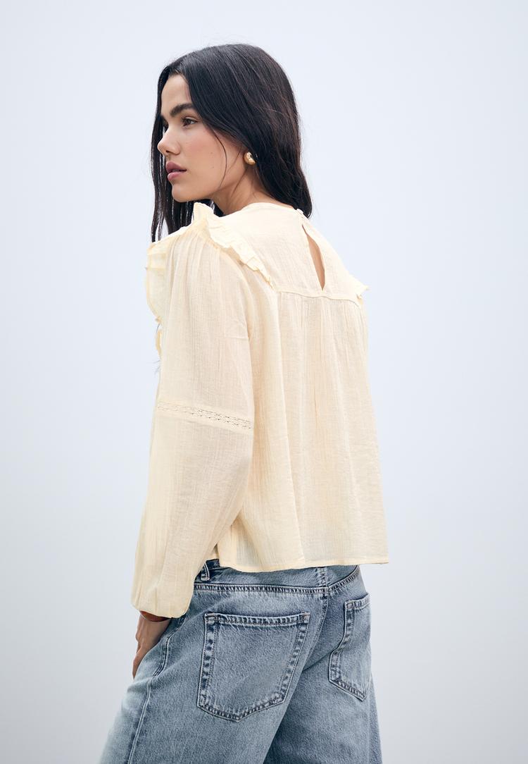 ruffled blouse with lace trim