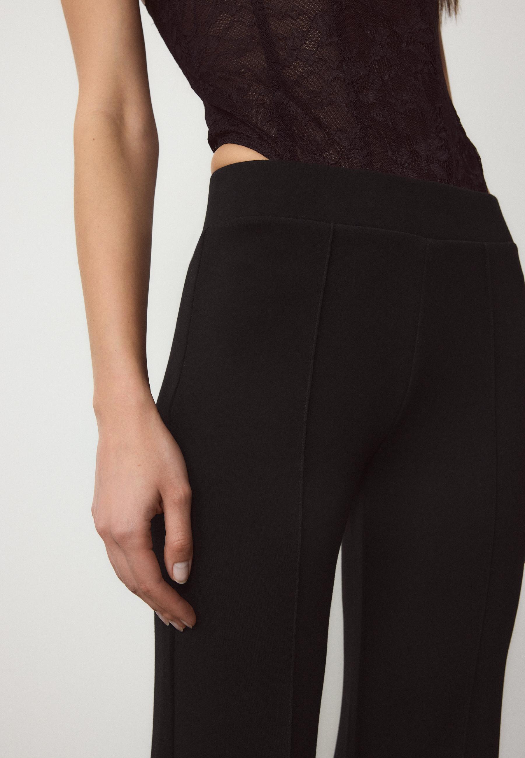 Soft-touch bell bottom trousers with front seam detail — Black
