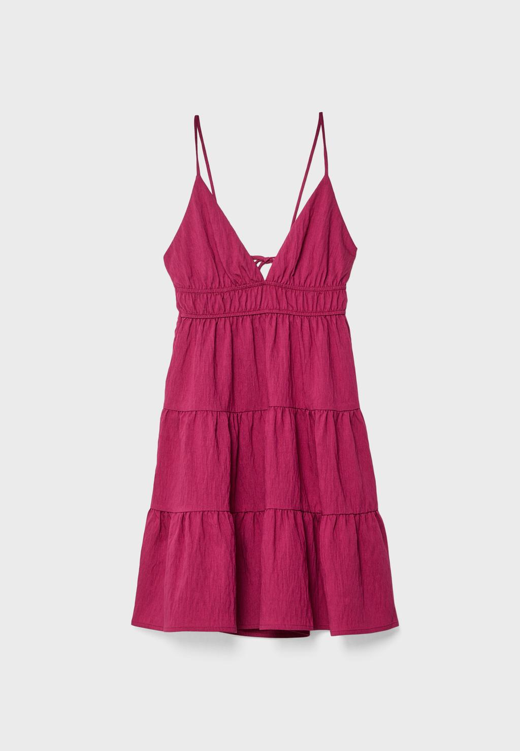 Short flowing dress with tied detail at the back