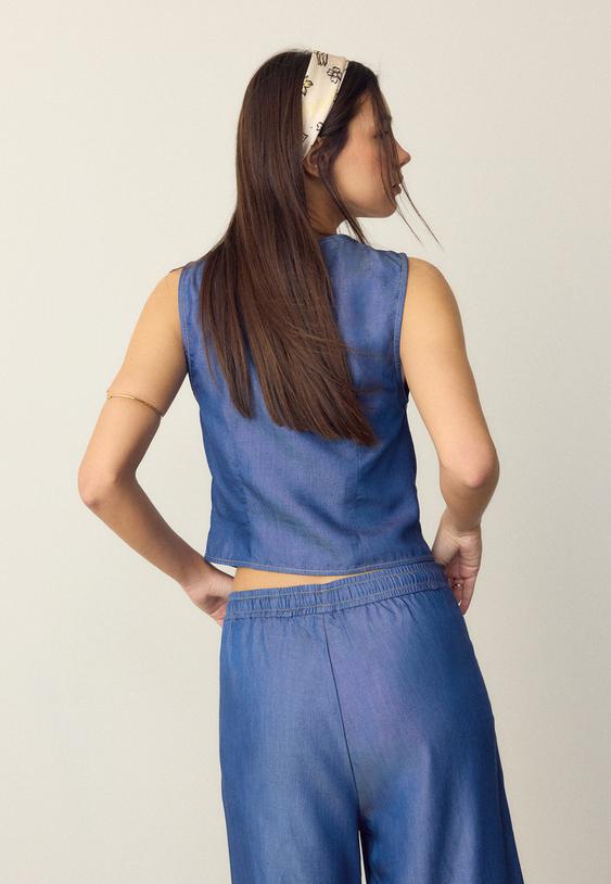 top sem mangas com botoes de ganga