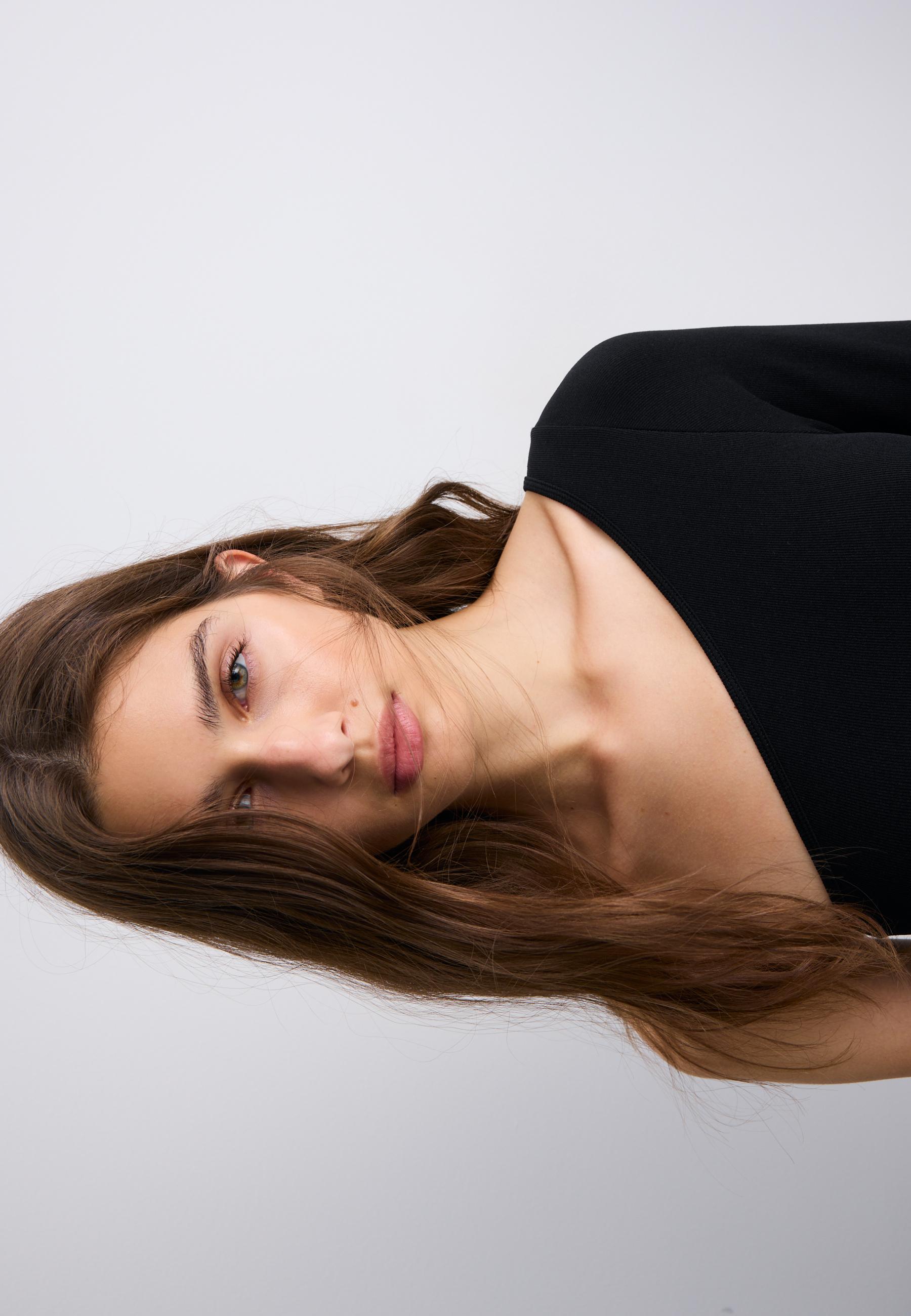 Asymmetric bodysuit with sheer details — Black
