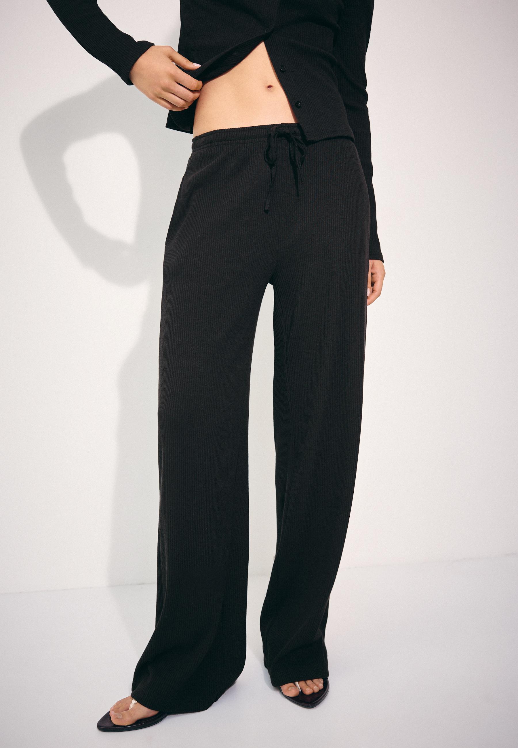 Soft-touch ribbed trousers — Black