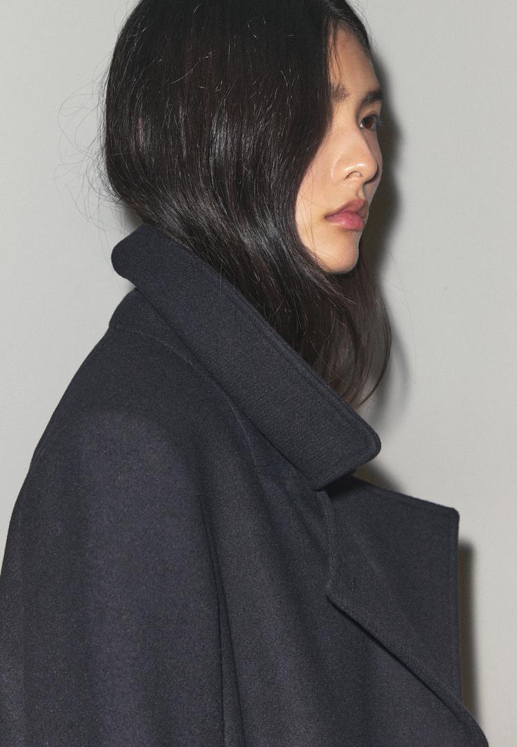 coat with faux fur collar with felt texture