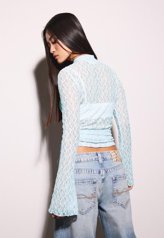 maglietta in pizzo a maniche lunghe