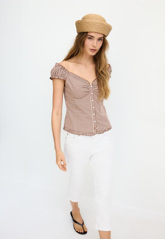 top a boutons coupe basse poitrine manches courtes