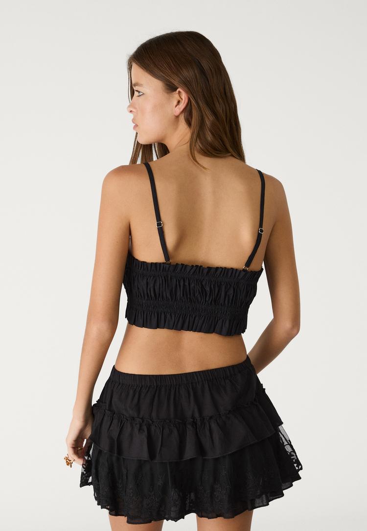 top court a bretelles