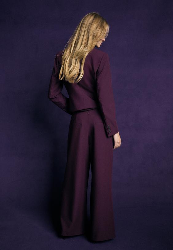 pantaloni eleganti wide leg con bottoni regolabili