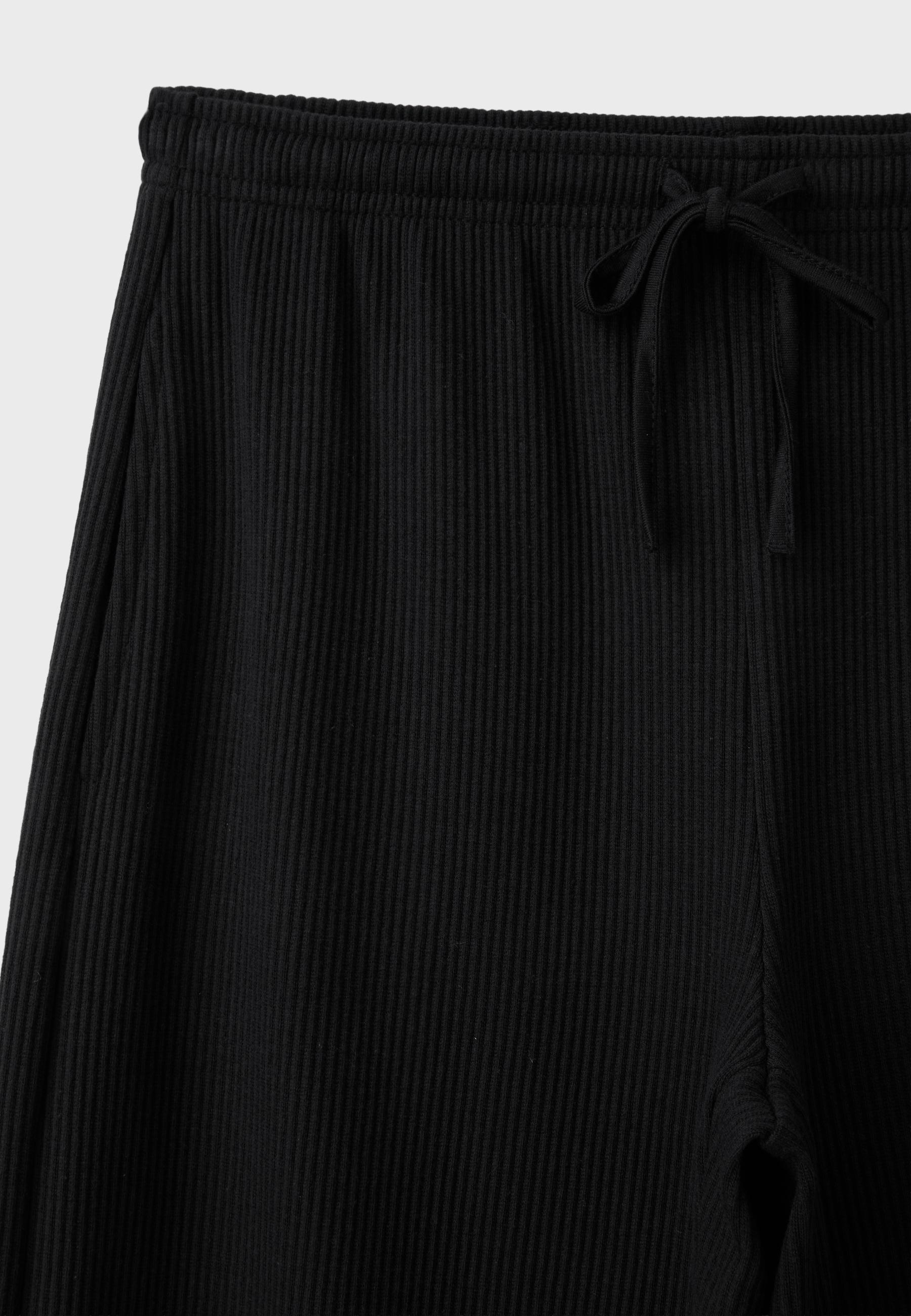 Soft-touch ribbed trousers — Black