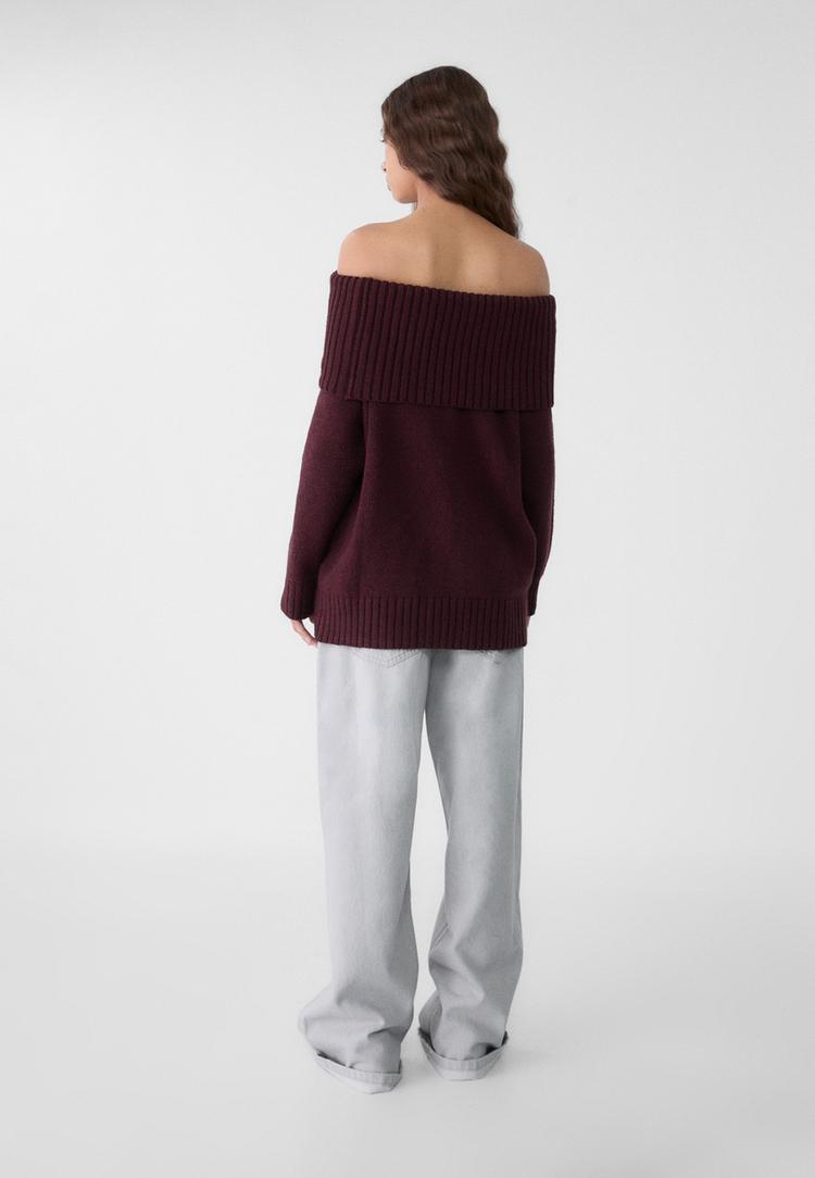 maglia in maglia con spalle scoperte