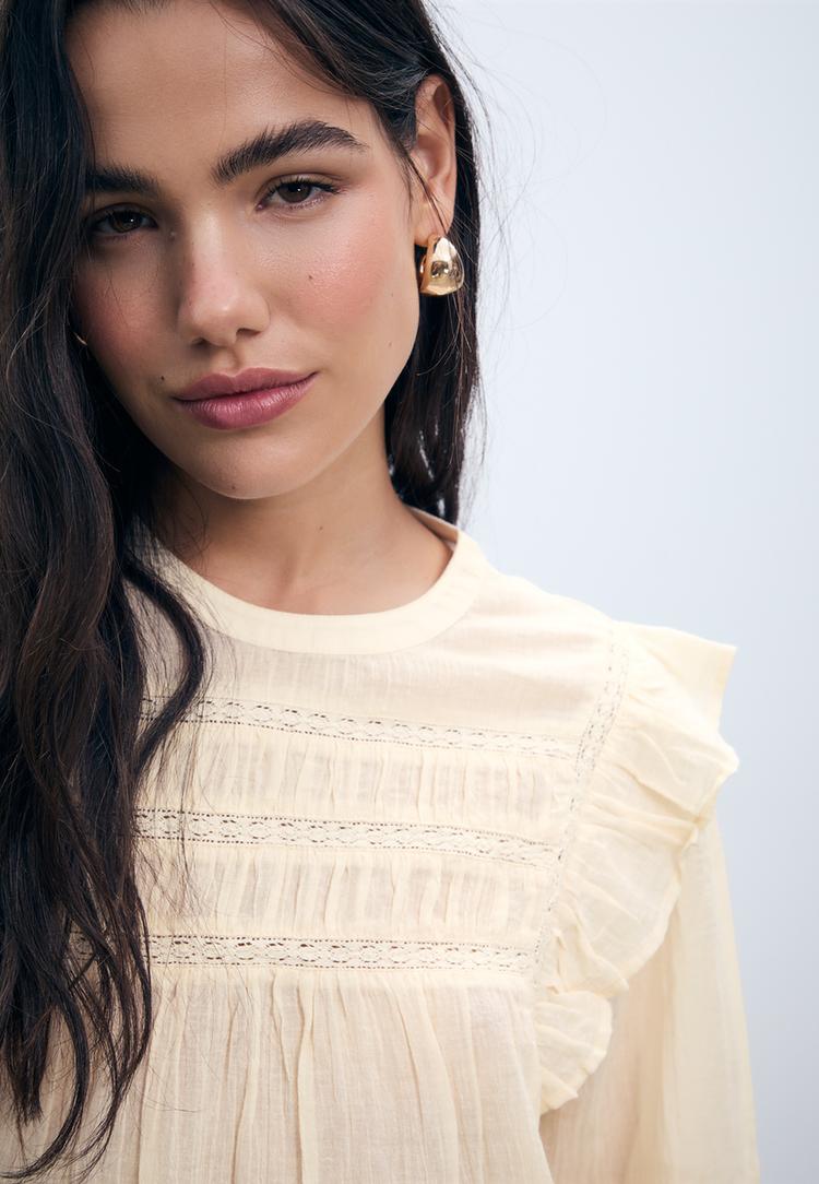 ruffled blouse with lace trim