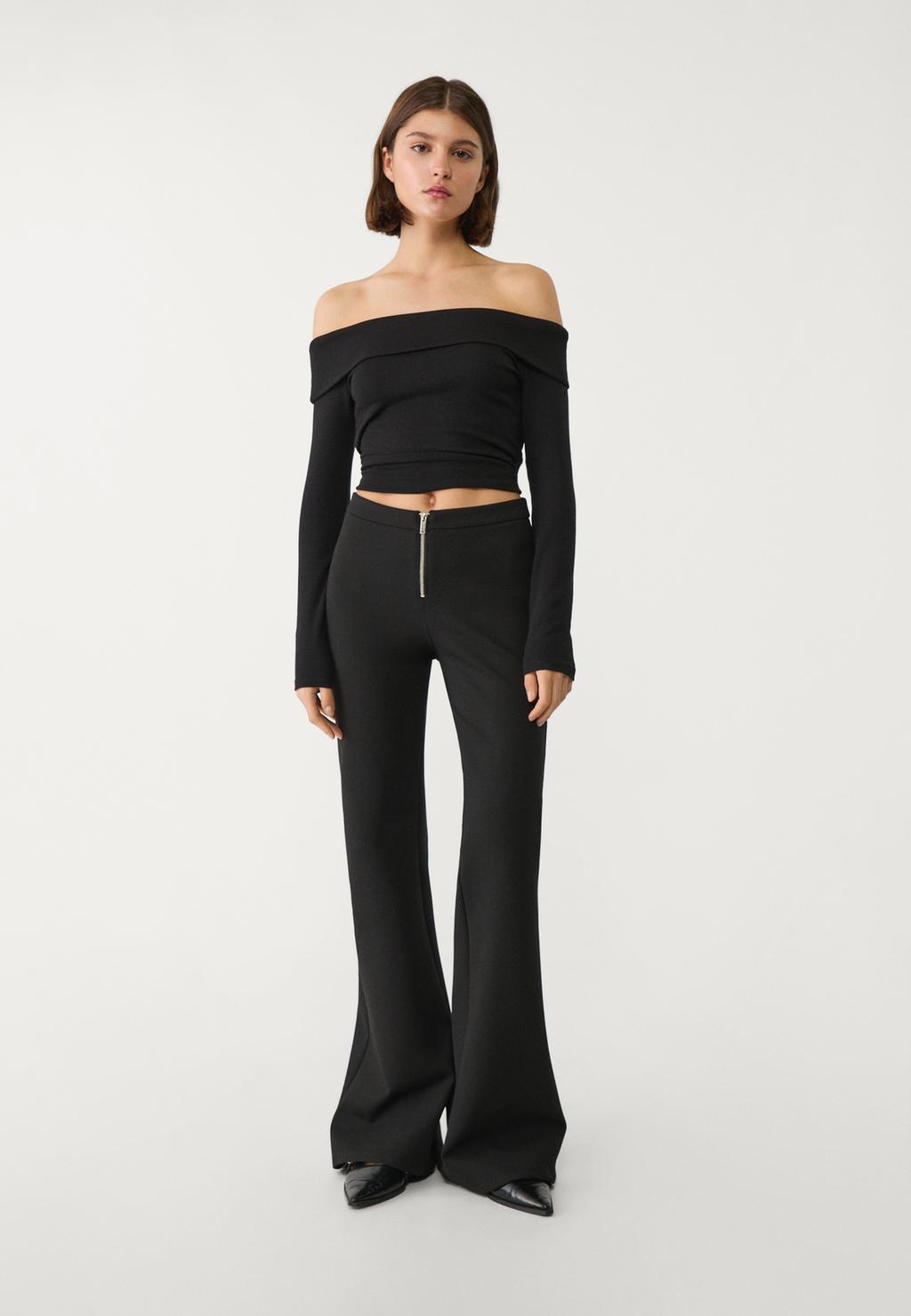 Flared trousers with zip